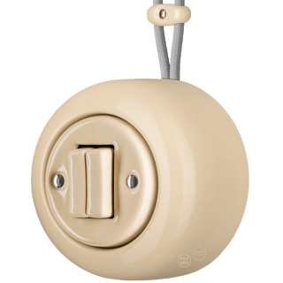 PORCELAIN ROUND SURFACE MOUNTED DOUBLE SLIM BUTTON SWITCH SAND - DYKE & DEAN
